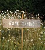 Sign Pole Among Field